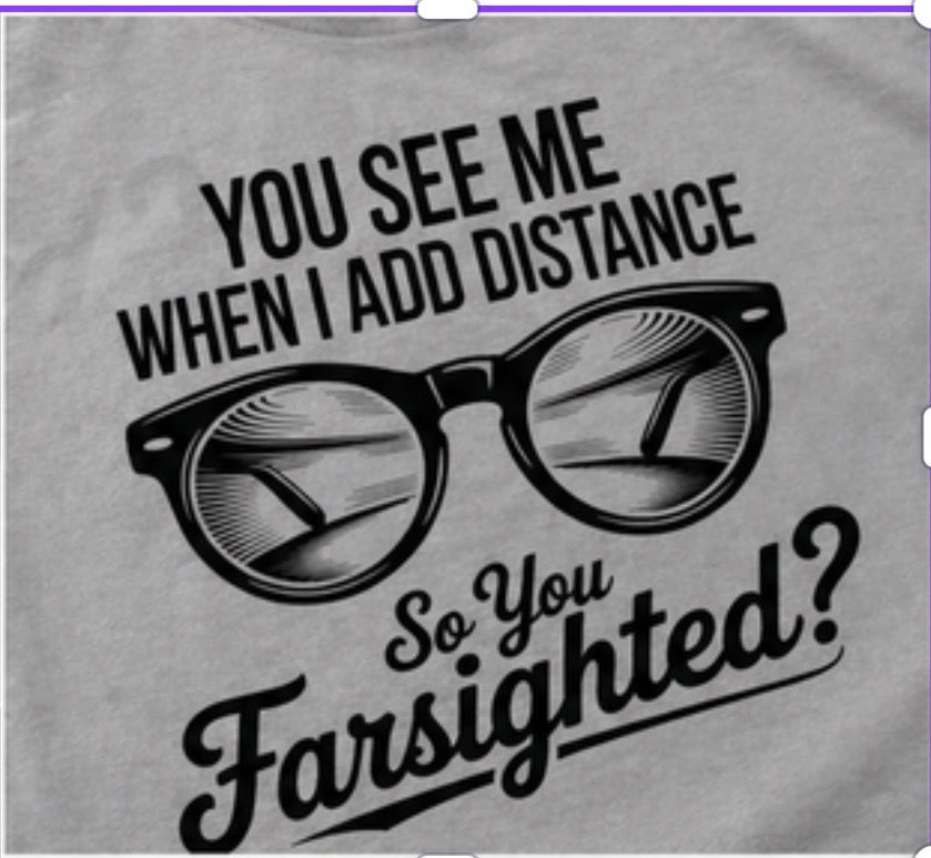 Gray sweatshirt with black glasses graphic and text 'You see me when I add distance, so you farsighted?'