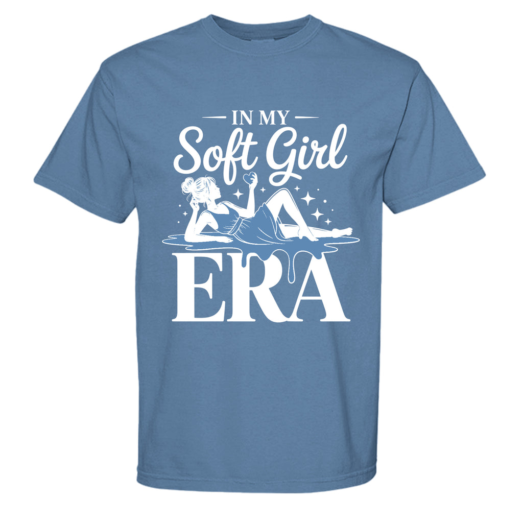 Blue t-shirt with white graphic and text 'In My Soft Girl Era' on a white background