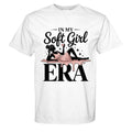 White t-shirt with graphic design and text 'In My Soft Girl Era' on a white background